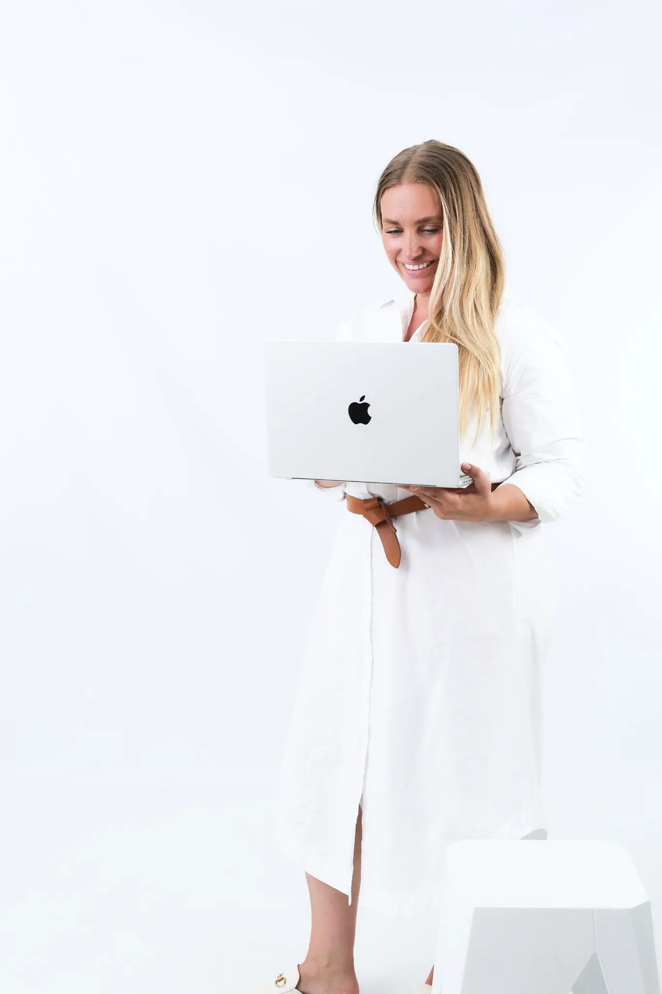 Krista Recker, Greater Boston real estate agent, working on a laptop